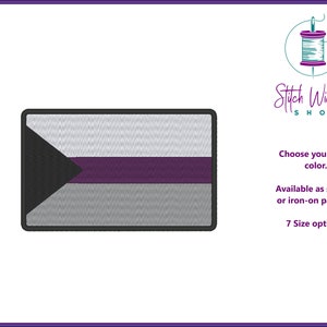 May include: An embroidered patch featuring the asexual pride flag. The flag is a black triangle on a white background with a purple stripe across the middle. The patch is available in 7 sizes and can be sewn or ironed on.