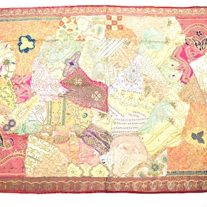 May include: A colorful patchwork quilt with a variety of fabrics and textures. The quilt is made up of many different pieces of fabric, each with its own unique pattern and color. The quilt is edged with a red border.