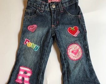 Girls vintage Roxy patched jeans.