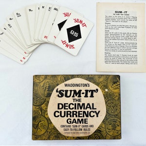 May include: A vintage board game box with a gold background and a picture of coins. The box says "Waddington's 'Sum-It' The Decimal Currency Game" and "Contains 'Sum-It' Cards and Easy-to-Follow Rules".