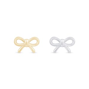 May include: Two bow-shaped stud earrings. One is gold-coloured, the other is silver-coloured. The earrings are small and delicate, with a simple, elegant design. They are set against a white background.