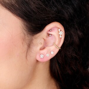 a close up of a person with a ear piercing