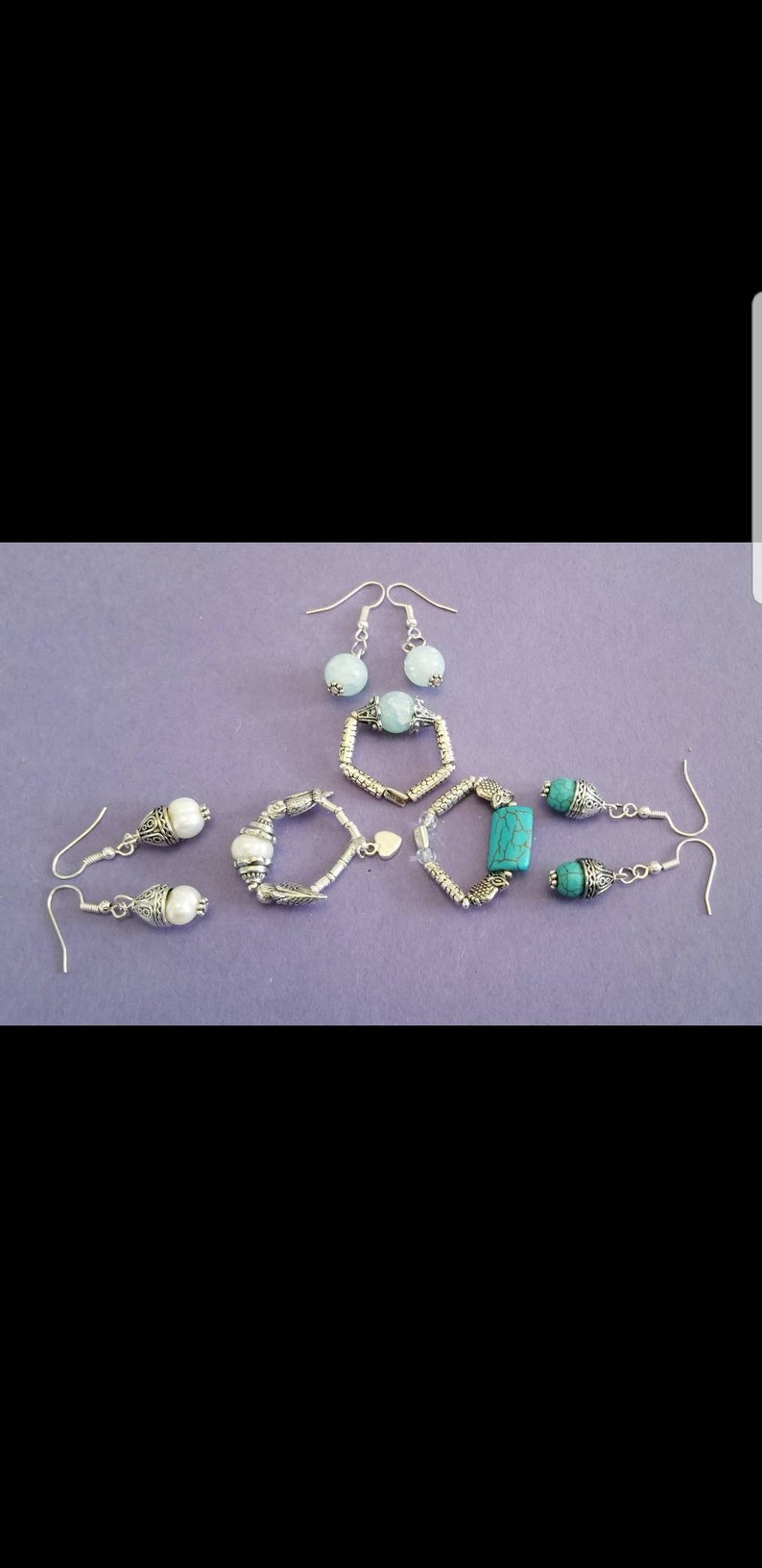 A Set of Earrings with a Flexible Ring StonePearlGlass From The New Original Zartical Collection