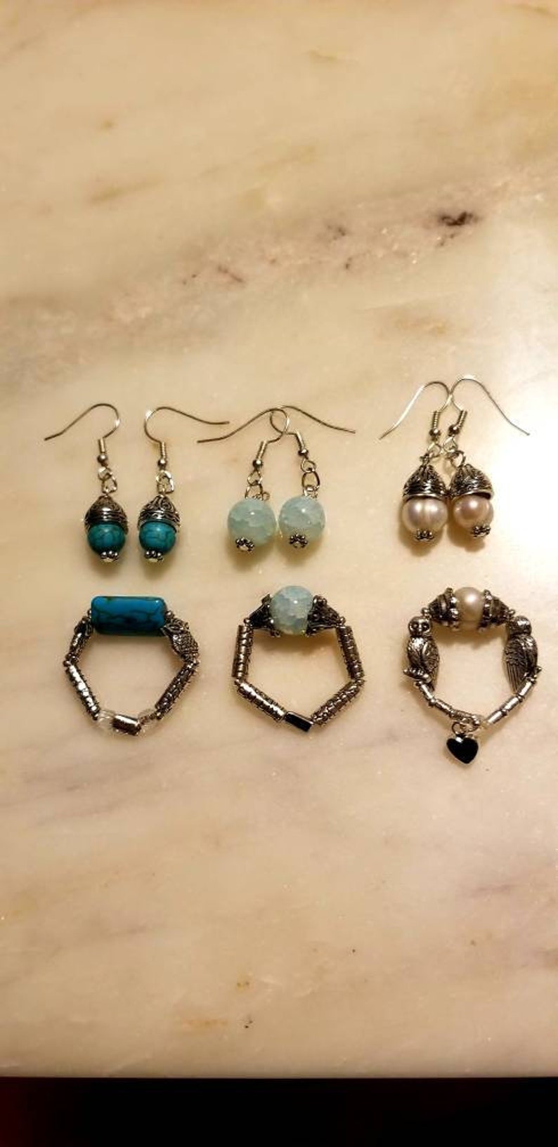 A Set of Earrings with a Flexible Ring StonePearlGlass From The New Original Zartical Collection