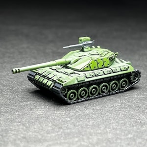 May include: A green toy tank with a long barrel and a small turret. The tank has a detailed design with many small parts.
