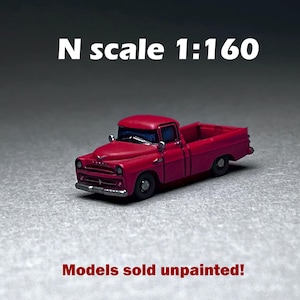 May include: A red N scale 1:160 pickup truck model. Models sold unpainted.