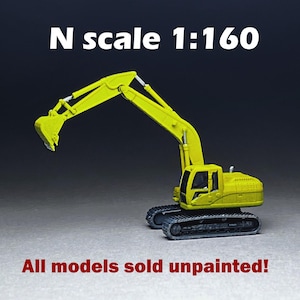May include: A yellow N scale 1:160 model excavator with a black track. All models sold unpainted.