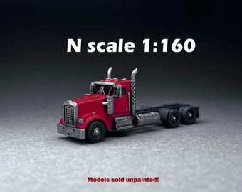 May include: A red N scale 1:160 model truck with a silver grill, exhaust pipes, and fuel tanks. The model is unpainted. The text "N scale 1:160" is displayed above the truck.