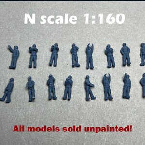 May include: N scale 1:160 unpainted model figures. The figures are in various poses, including standing, raising arms, and looking up. The text "All models sold unpainted!" is in red.