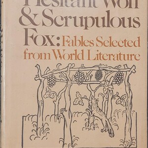 Puede incluir: Portada de libro vintage con el título "Hesitant Wolf & Scrupulous Fox: Fables Selected from World Literature". La portada es beige con texto marrón y una ilustración en blanco y negro de un zorro y vides.