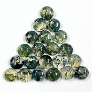 May include: A collection of 20 round, green and white moss agate cabochons. The cabochons are smooth and polished, with a variety of patterns and textures.