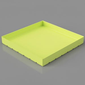 May include: A square, lime green tray with a raised edge. The tray has a smooth, matte finish and is set against a gray background. The sides of the tray have small, evenly spaced holes.