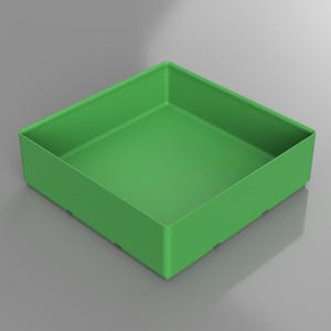 May include: A square, open-top container in a vibrant green hue. The container has a simple, modern design with straight sides and a flat base. The overall shape is a perfect square, suitable for storage or display.