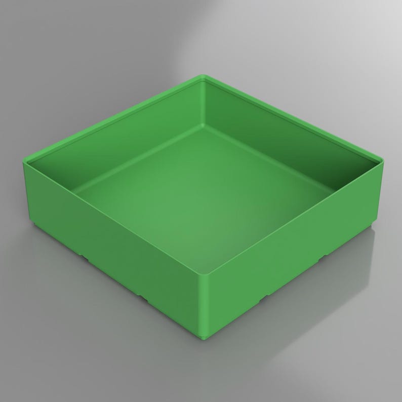 May include: A square, open-top container in a vibrant green hue. The container has a simple, modern design with straight sides and a flat base. The overall shape is a perfect square, suitable for storage or display.