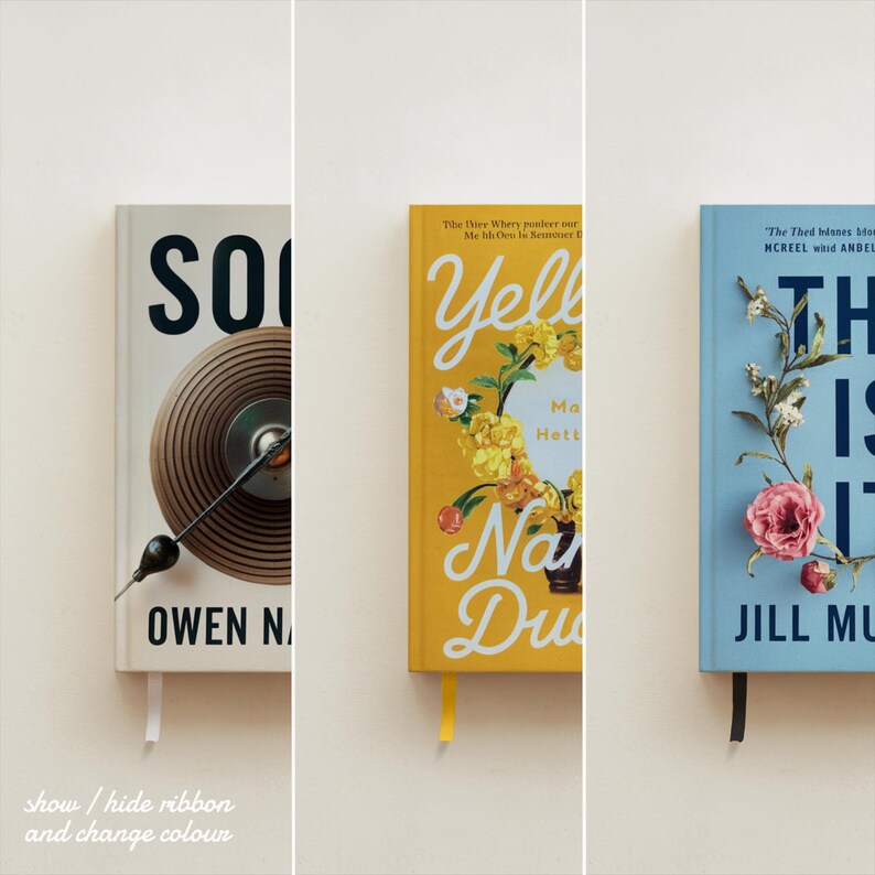 May include: Three hardcover books with colorful covers. The book on the left has a black and white illustration of a record player. The book in the middle has a yellow cover with a floral illustration and the text "Yellow Houses". The book on the right has a blue cover with a floral illustration and the text "This Is It".