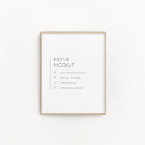 May include: A gold frame mockup with a white background. The text "FRAME MOCKUP" is written in black text. A checklist with the following items is written in black text: HIGH RESOLUTION FILES, PSD FILE + JPEG FILE, SMART OBJECTS, CHANGE WALL COLOR.