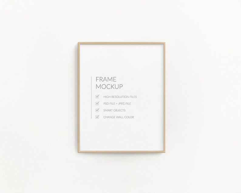 May include: A gold frame mockup with a white background. The text "FRAME MOCKUP" is written in black text. A checklist with the following items is written in black text: HIGH RESOLUTION FILES, PSD FILE + JPEG FILE, SMART OBJECTS, CHANGE WALL COLOR.
