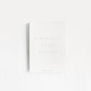 May include: A white book mockup with the text "MINIMALIST BOOK MOCKUP" and the website "thewhitespace" at the bottom.