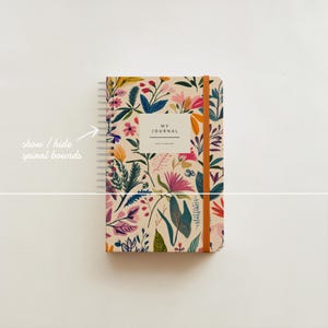 May include: A spiral bound journal with a floral pattern in shades of pink, yellow, green, and blue. The cover reads "My Journal" in a white rectangle.