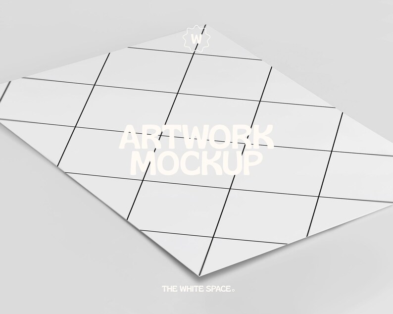 May include: A white sheet of paper with a grid pattern and the text "ARTWORK MOCKUP" in white. The text "THE WHITE SPACE." is at the bottom of the page.