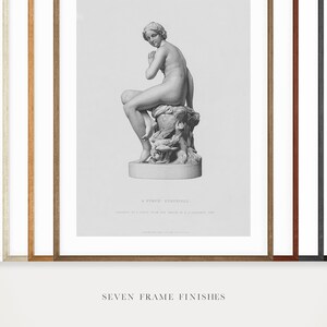 May include: Seven different frame finishes are shown, each framing a black and white print of a classical sculpture of a nude woman sitting on a rock. The print includes the text "A Nymph Asleep" and a description of the sculpture.