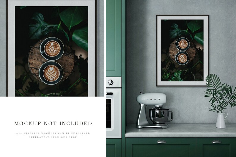 May include: Two cups of coffee with latte art on a wooden surface surrounded by green leaves in a black frame hanging on a wall in a kitchen setting.