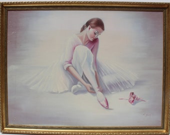May include: A framed painting of a ballerina in a white tutu, sitting on the floor and tying her pink ballet shoe. The background is a soft, light pink.
