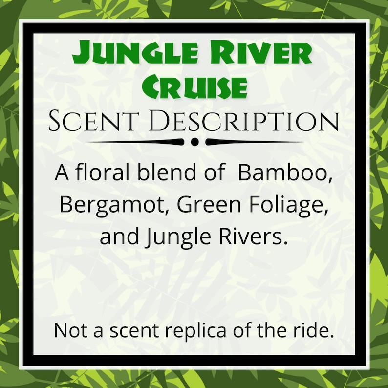 May include: A white sign with a black border and green text that reads "JUNGLE RIVER CRUISE SCENT DESCRIPTION." The text describes a floral blend of bamboo, bergamot, green foliage, and jungle rivers. The bottom of the sign reads "Not a scent replica of the ride."