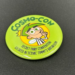 Cosmo Con Button