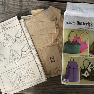 May include: A sewing pattern for making bags, including a backpack, a tote bag, and a satchel. The pattern is from Butterick and is numbered B4625. The pattern includes instructions and diagrams for making the bags.