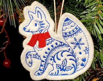 Winter Fox Ornament Embroidered on White Felt with Blue Accents and a Red Scarf. Polar Fox with Folk Art Designs.