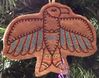 Southwest Thunderbird / Hawk Ornament. Felt Ornament Embroidered on Reddish Brown Felt with Colorful Stitching.