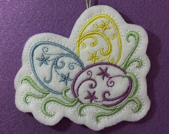 Easter Eggs Ornament with Swirls and Stars Embroidered on White Felt with Spring Colors of Lilac, Blue, Yellow and Light Green. Easter Decor