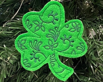 St. Patrick's Day Irish Shamrock with Leaves and Swirls Design Embroidered on Green Felt with Dark Green Stitching.