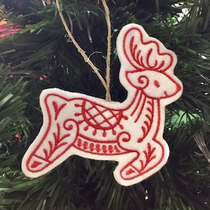 White and Red Reindeer Ornament Embroidered on Felt.