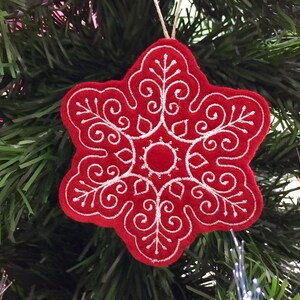 Red and White Snowflake Ornament Embroidered on Felt.