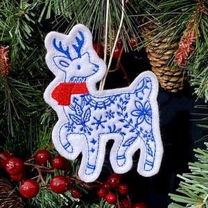 Winter Deer Ornament Embroidered on White Felt with Blue Accents and a Red Scarf. Deer with Folk Art Designs.