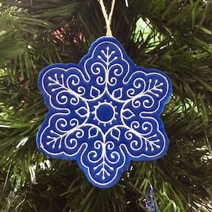 Blue and White Snowflake Ornament Embroidered on Felt.