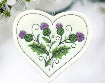 Scottish Thistle in a Heart Shaped Ornament Embroidered on White Felt with 2 Purples and 2 Greens. Beautiful colors and dimension.