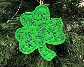 St. Patrick's Day Irish Shamrock with Leaves and Swirls Design Embroidered on Green Felt with Dark Green Stitching.