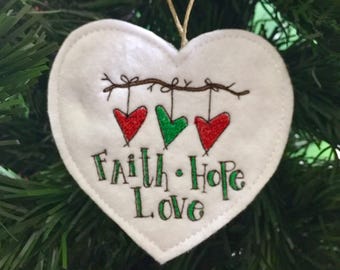 Primitive Hearts Faith Hope Love Ornament. Trio of Prim Hearts Tied to a Branch Embroidered on Felt with Faith Hope and Love below.