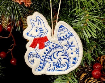Winter Fox Ornament Embroidered on White Felt with Blue Accents and a Red Scarf. Polar Fox with Folk Art Designs.
