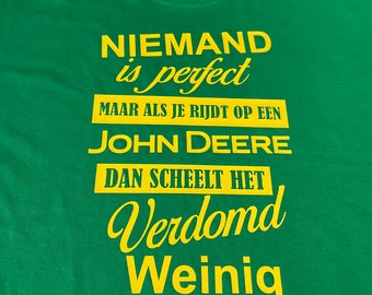 No one is perfect, but if you ride a John Deer it doesn't make much difference! Green t-shirt!