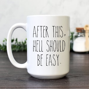 May include: White ceramic coffee mug with black text that reads "After this, hell should be easy."