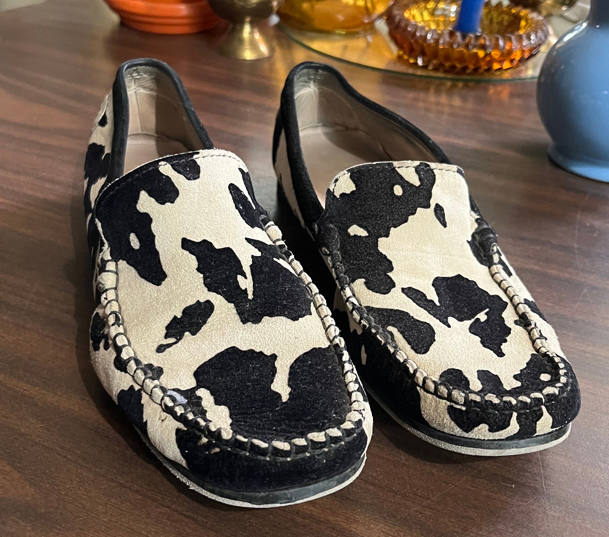Cow shop print loafers