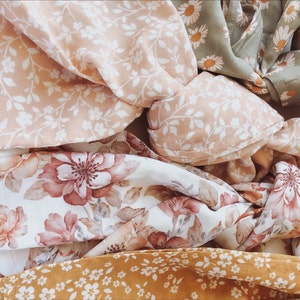 Fall floral muslin swaddle collection showing all 4 beautiful lightweight swaddle blankets perfect for fall/autumn