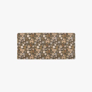 Top view of a floral changing pad cover from Mini Wander