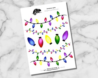 May include: A printable sheet of Christmas lights in various colors, including red, green, blue, yellow, and purple. The lights are strung together in a festive design. The text "Christmas Lights" and "DesignerChameleon.com" is at the top of the sheet. The text "Share on IG and tag @DesignerChameleon" is at the bottom of the sheet.