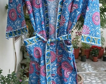 May include: A blue and pink floral cotton robe with a tie belt. The robe has a traditional Japanese kimono style.