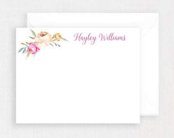 May include: A white stationery card with a floral design in pink, yellow, and green. The text "Hayley Williams" is printed in pink at the top of the card.